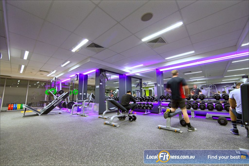 Anytime Fitness key fob and membership card on table